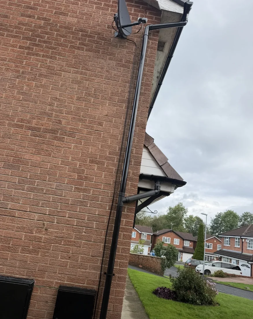Black rainwater downpipe installation